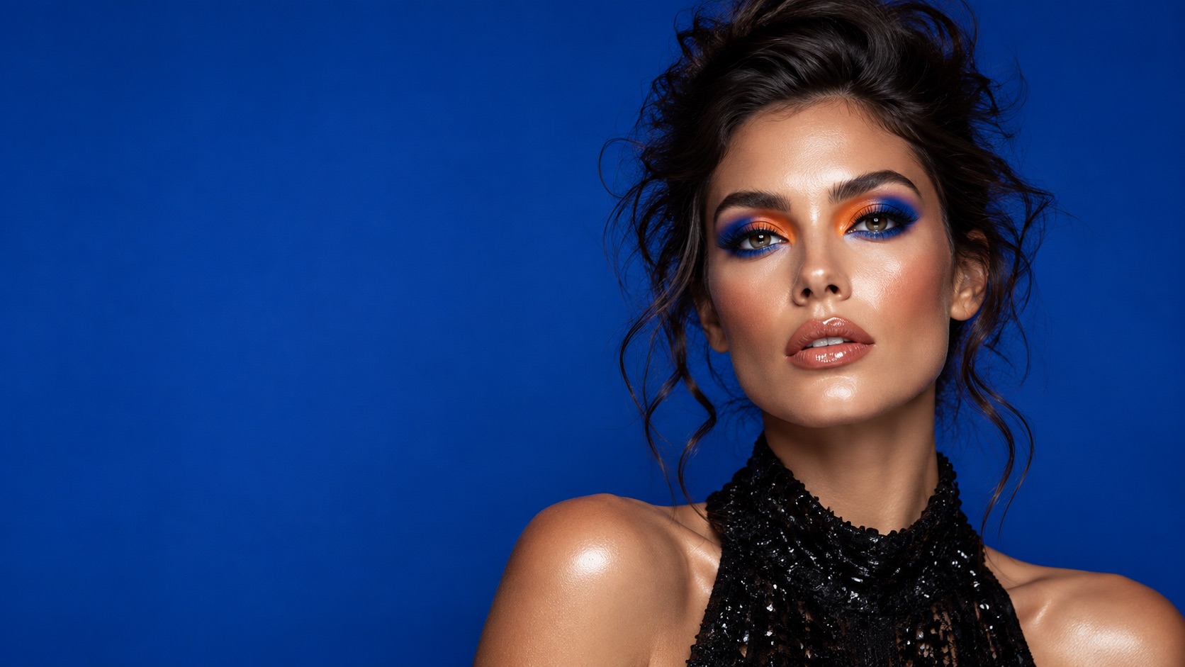 Commercial beauty campaign with vivid blue and orange makeup