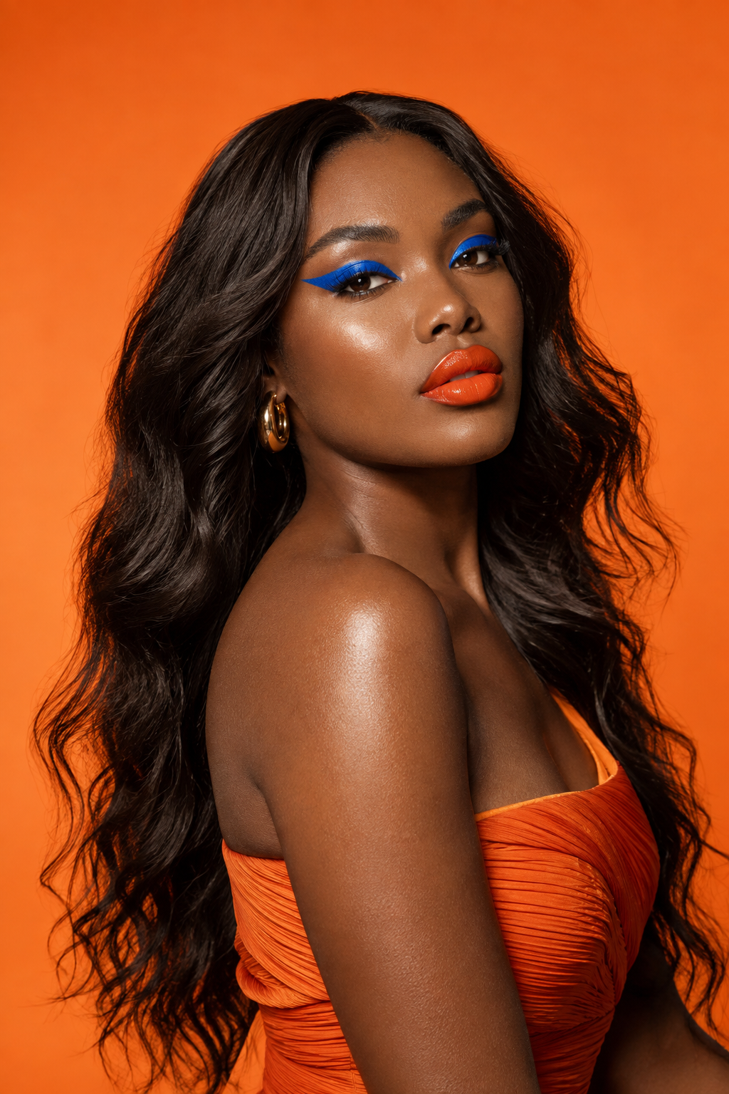 Cobalt eyeliner and orange commercial beauty portrait
