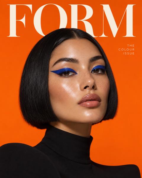 FORM fictional magazine cover featuring cobalt graphic eyeliner on an orange background