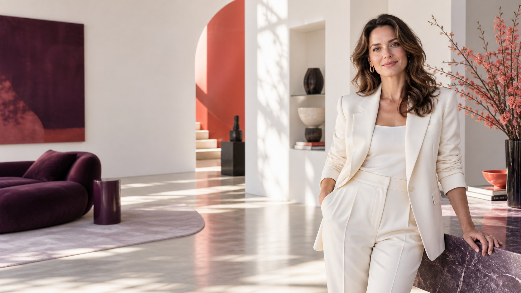 Executive coach standing confidently in a bright contemporary studio